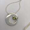 Fancy Silver Circle Peridot Pendant
