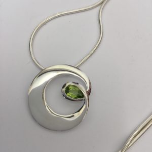 Fancy Silver Circle Peridot Pendant