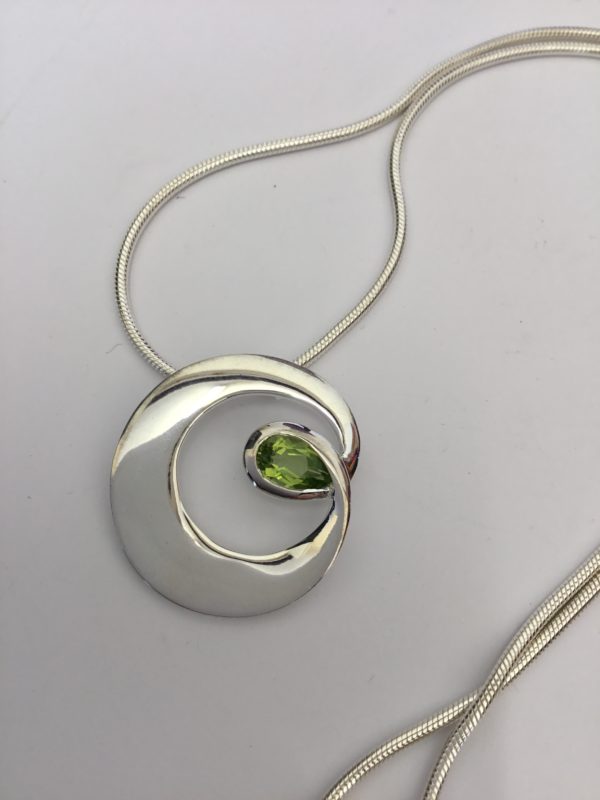 Fancy Silver Circle Peridot Pendant