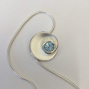 Fancy Silver Circle Blue Topaz Pendant