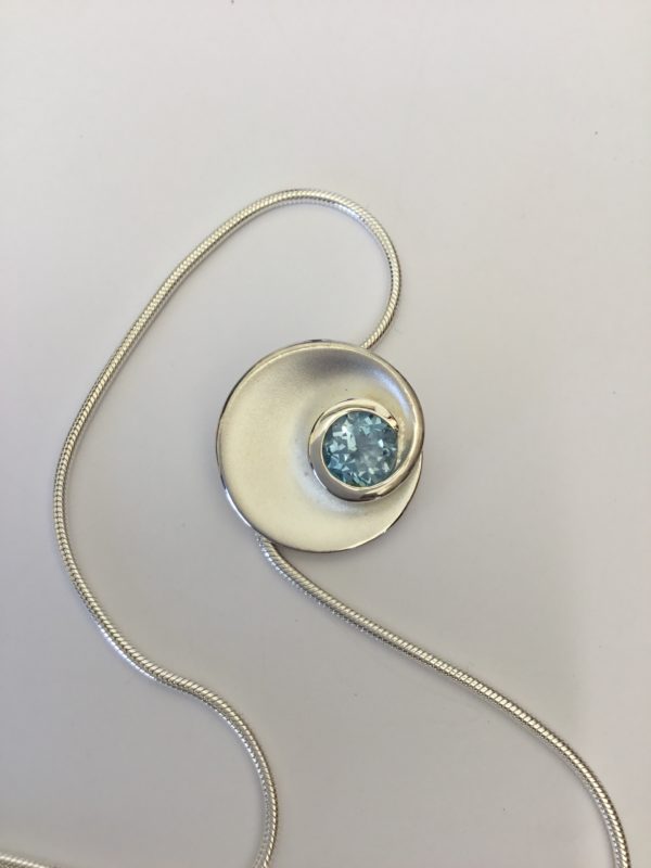 Fancy Silver Circle Blue Topaz Pendant