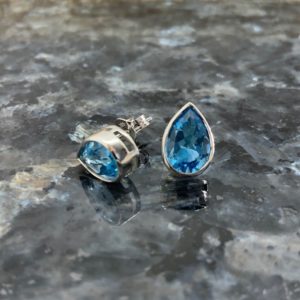 9ct White Gold Pear Shape Blue Topaz Rubover Studs